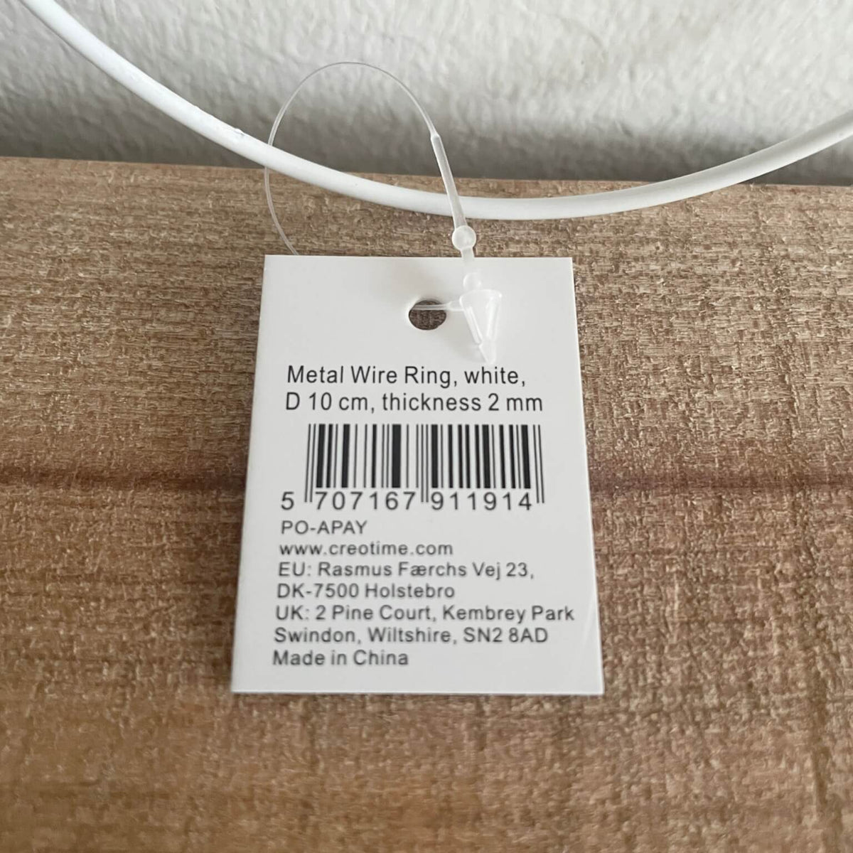 Metalring 10 cm – nærbillede af etiket med produktinfo