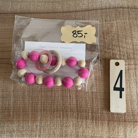 Færdig bidering med pink silikoneperler og træperler i pose, pris 85 kr