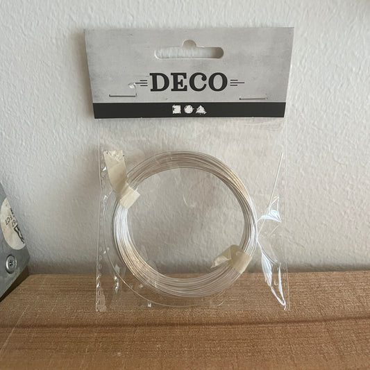 Sølvtråd 0,6 mm oprullet i klar emballage med DECO-mærkat