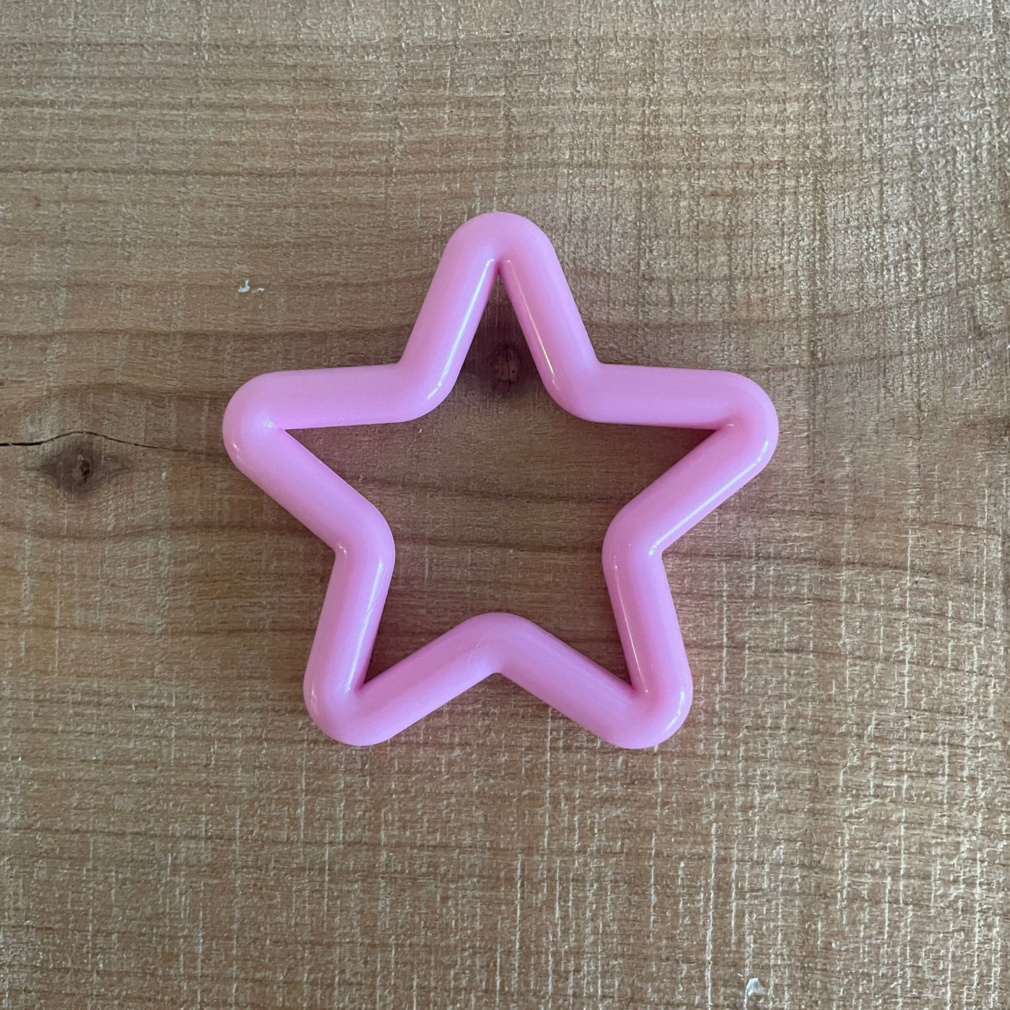 Stjerne i plastik, pink set fra en anden vinkel